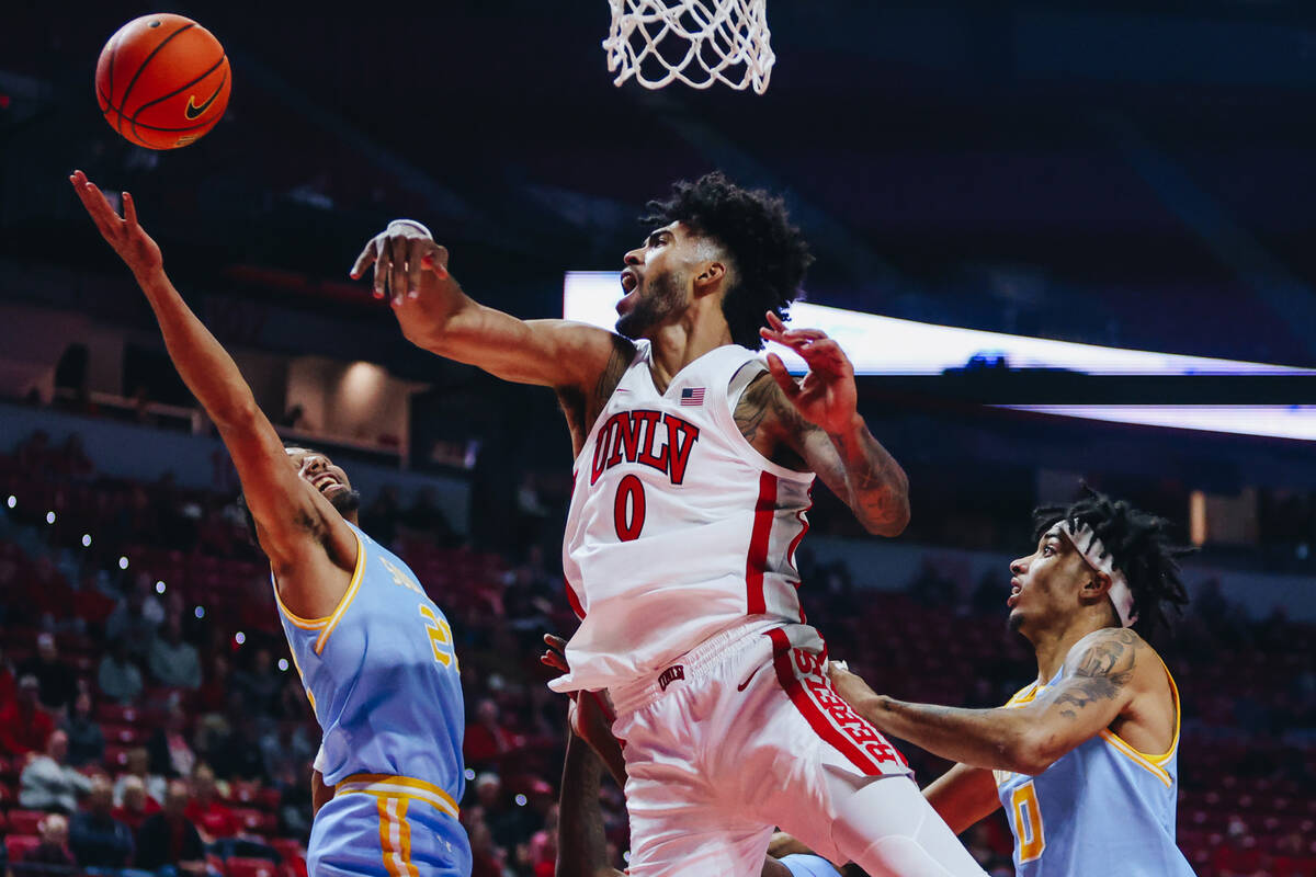 UNLV forward Isaiah Cottrell (0) loses the ball as he goes up for a layup during a game against ...