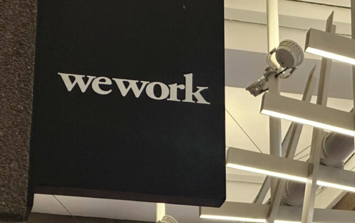 The WeWork logo appears on a building exterior in New York on Tuesday, Nov. 7, 2023. (AP Photo/ ...