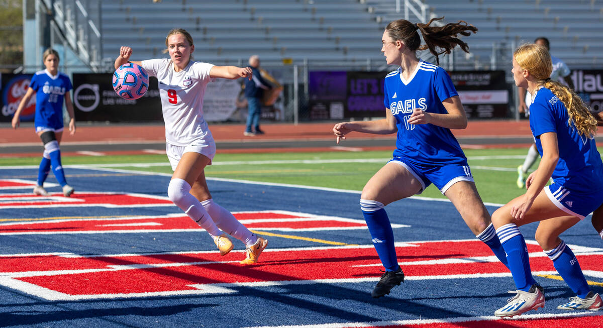 Coronado midfielder Ryan Neel (9) closes in on a goal shot opportunity as Bishop Gorman defende ...