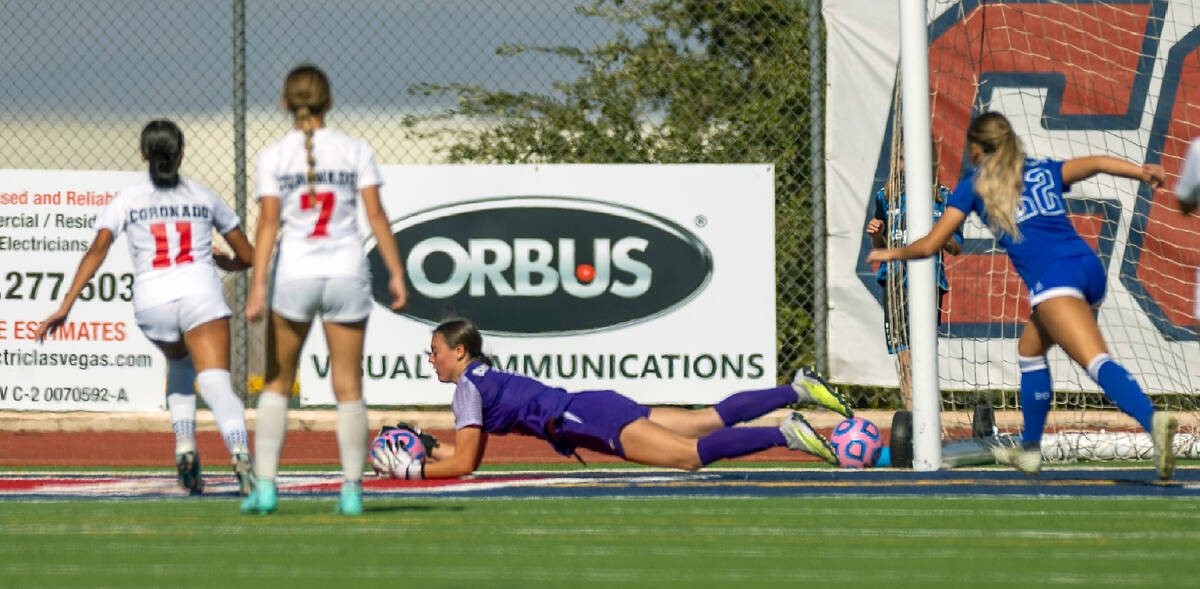 Coronado goalkeeper Megan Kingman (0) dives on a shot attempt from Bishop Gorman during the sec ...