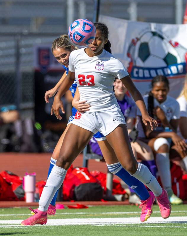 Coronado midfielder Sierah McCallum (23) heads the ball away from Bishop Gorman defender Audrey ...