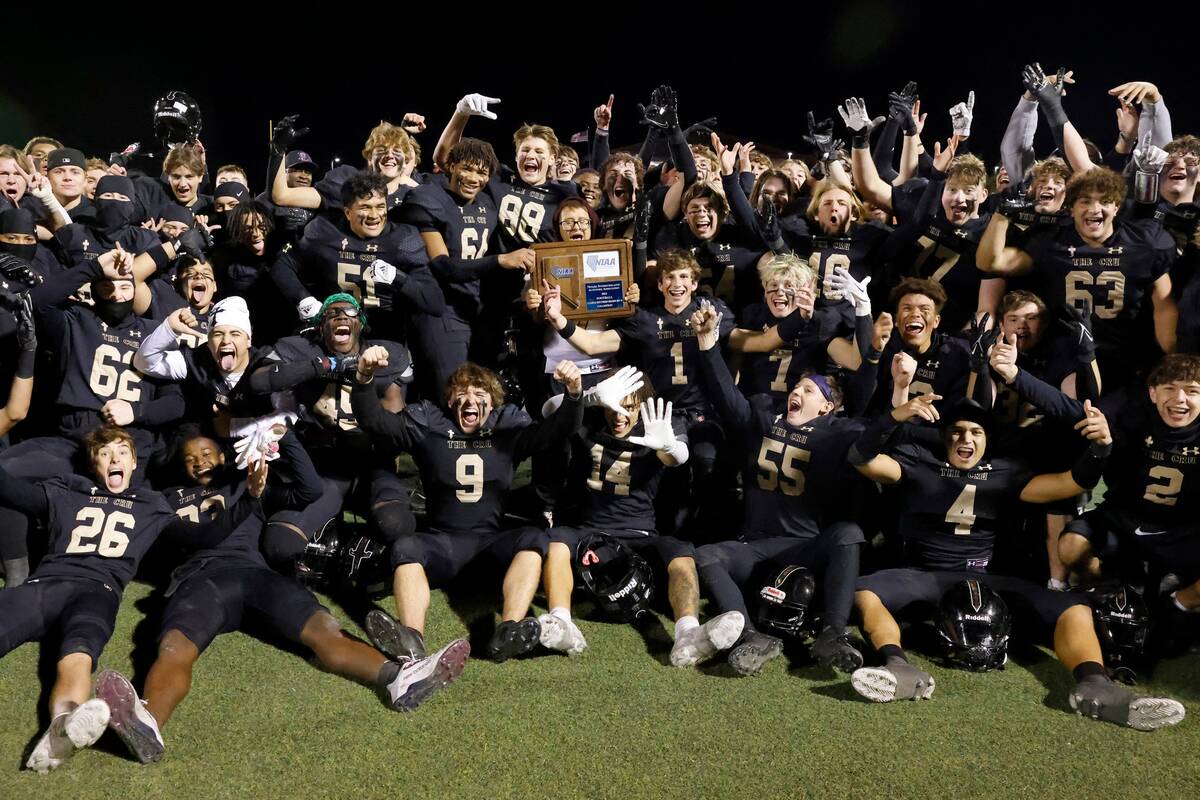 Faith Lutheran players celebrate their win against Green Valley after Class 5A Division II Sout ...