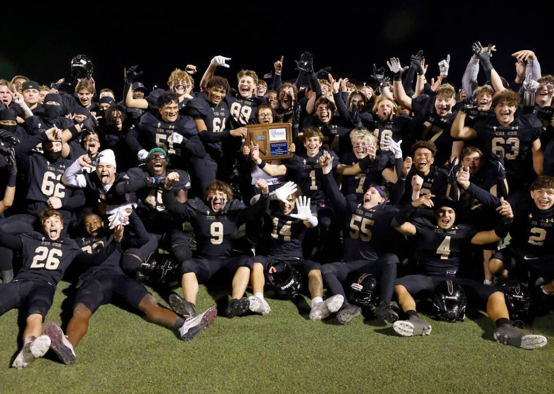 Faith Lutheran players celebrate their win against Green Valley after Class 5A Division II Sout ...