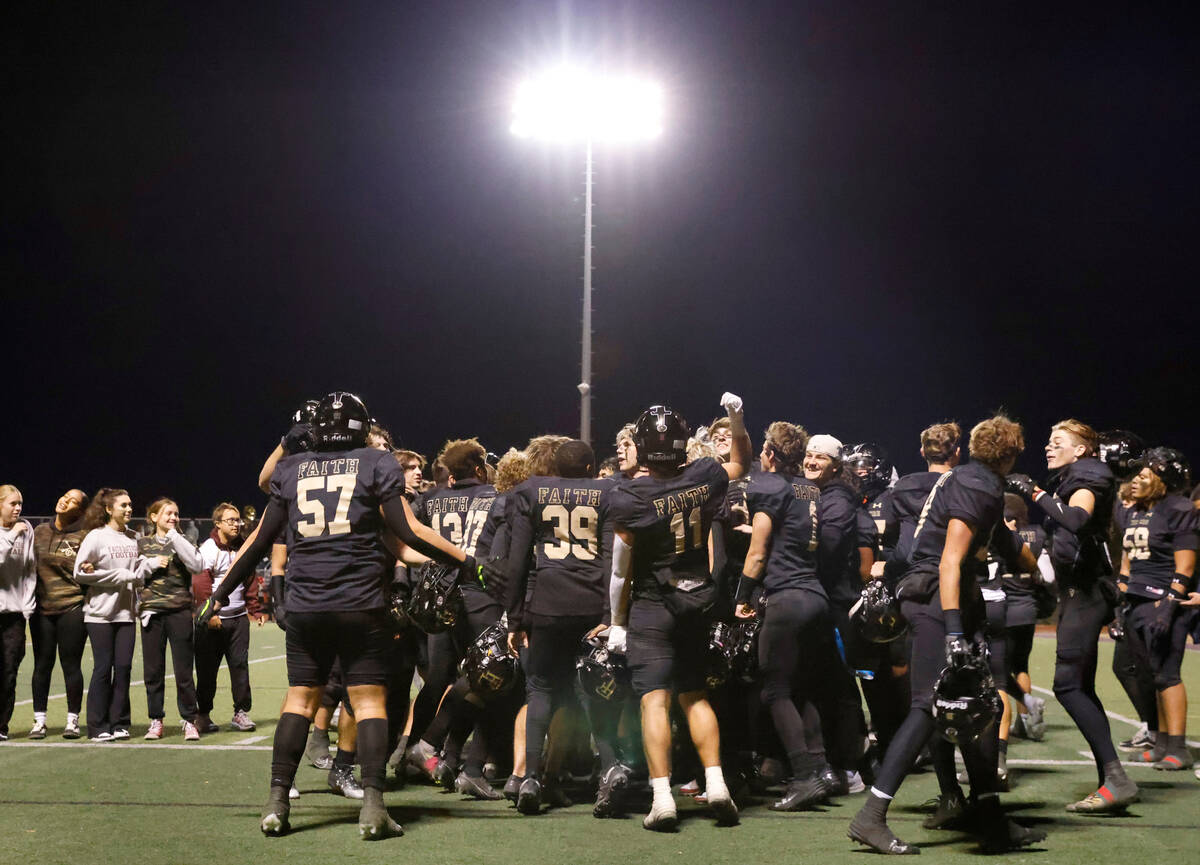 Faith Lutheran players celebrate their win against Green Valley after Class 5A Division II Sout ...