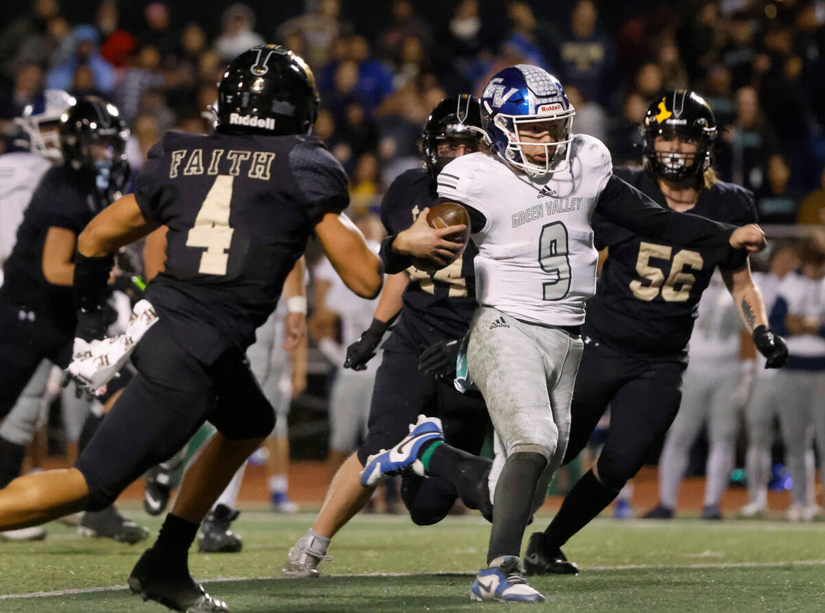 Green Valley's quarterback Jack Thow (9) is surrounded by Faith Lutheran's defense as he runs w ...