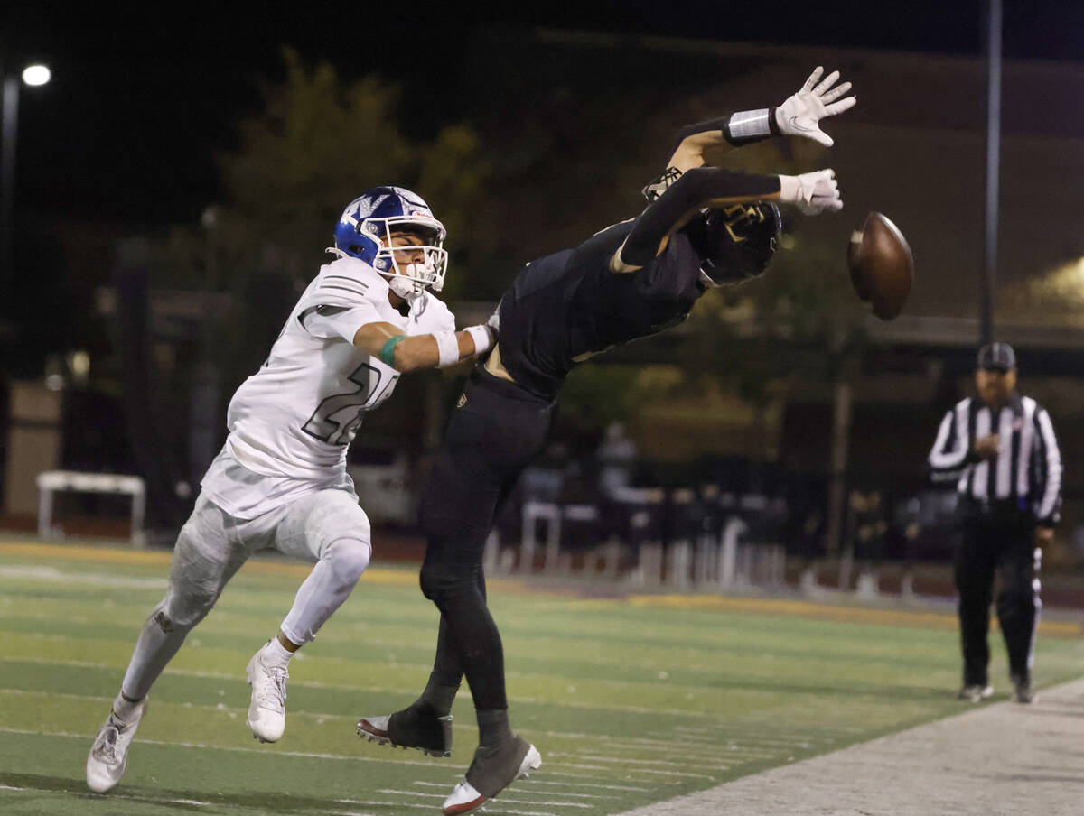 Faith Lutheran's wide receiver Mason Aday (7) stretches but unable to catch a pass as Green Val ...