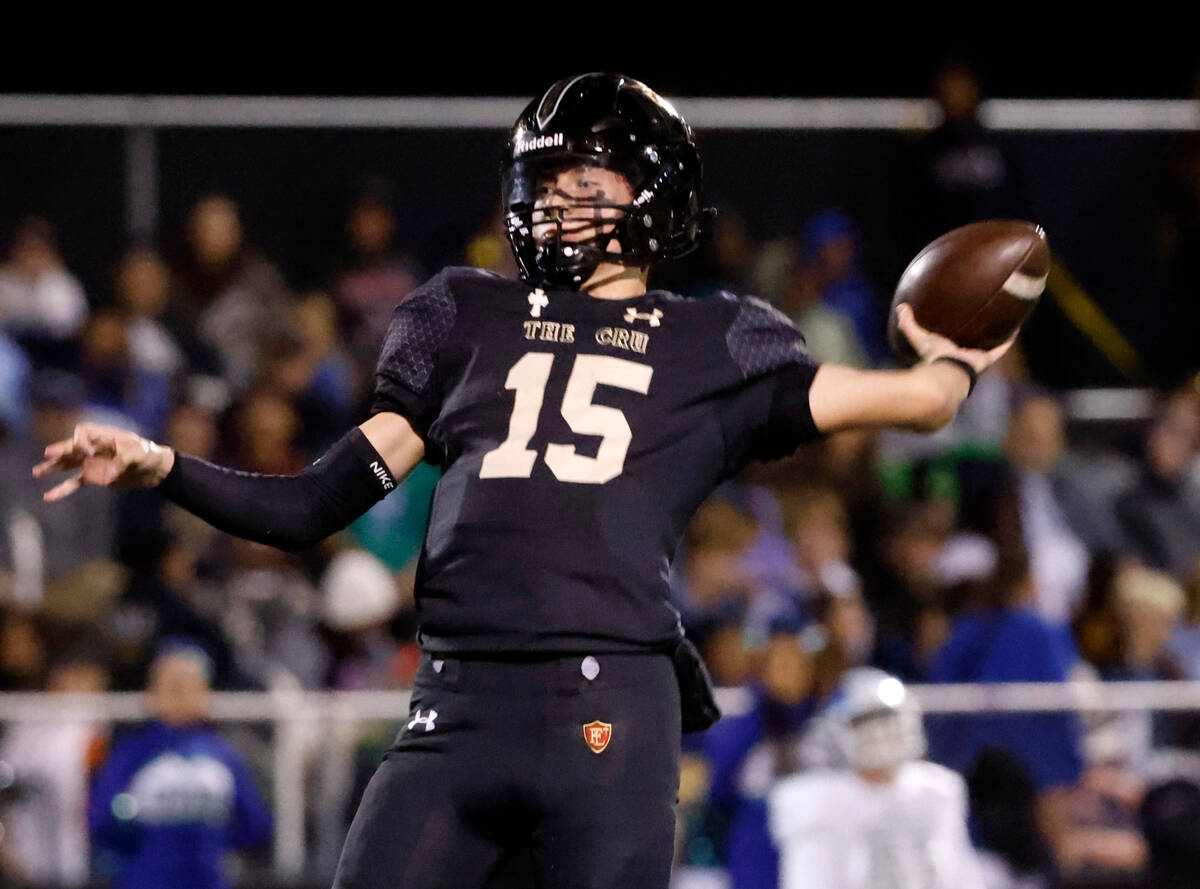 Faith Lutheran's quarterback Alex Rogers (15) throws a pass during the second half of a Class 5 ...