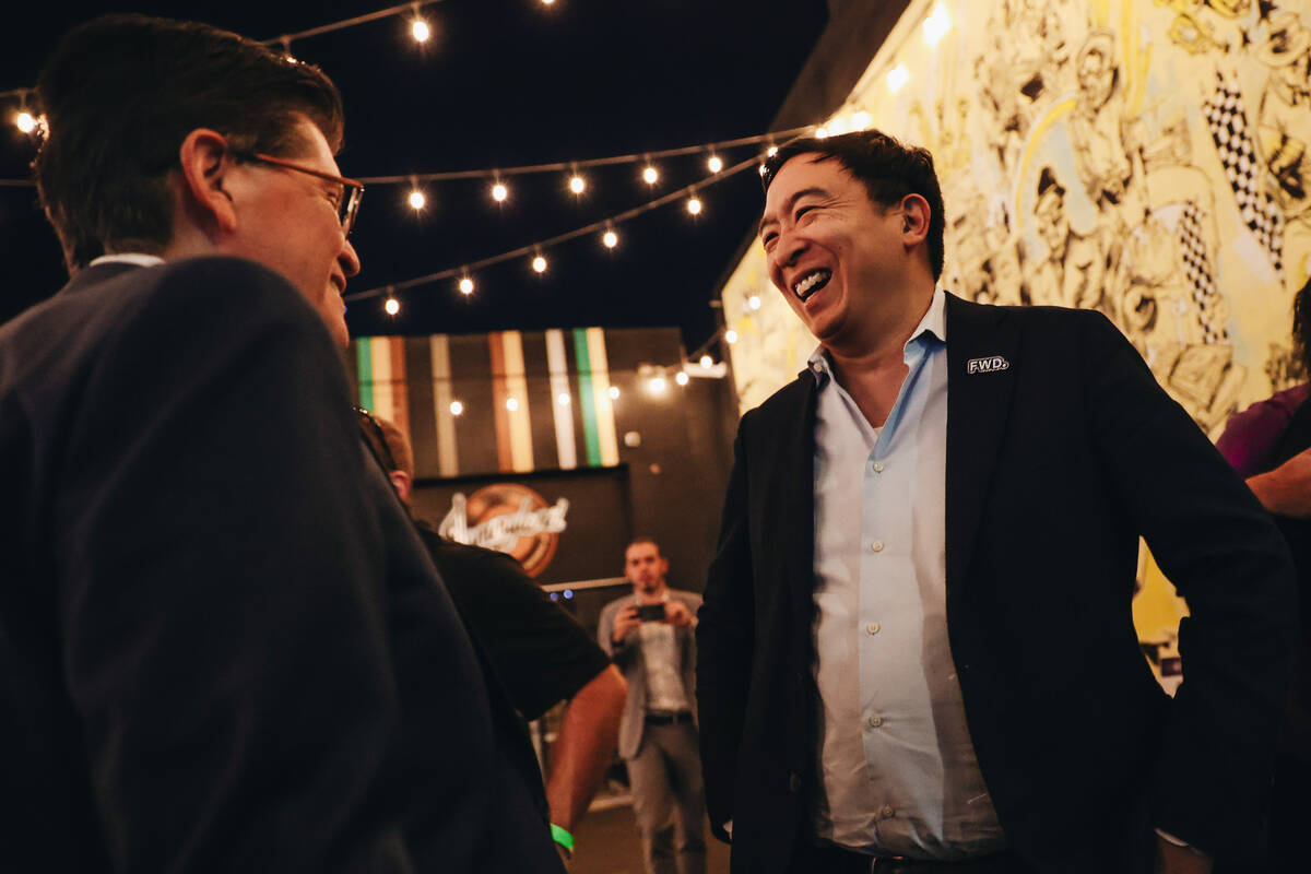 Andrew Yang, founder of the Forward Party, speaks to a supporter at a Forward Party event at Ja ...