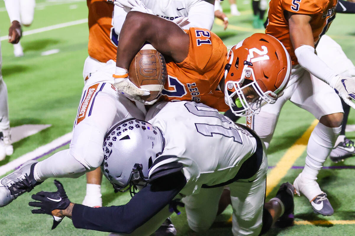 Palo Verde’s Cedric Cade Jr. (10) takes down Legacy’s Airamis Craven (21) during ...