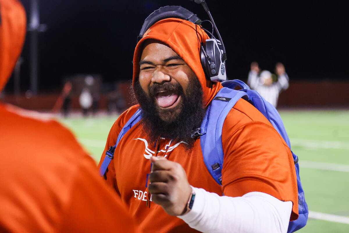 Legacy Assistant Coach Dominic Fuiava celebrates a touchdown during the Class 5A Division III S ...