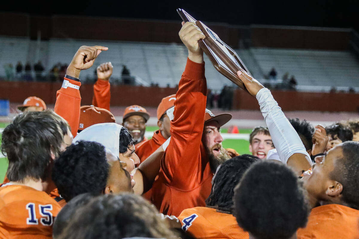 Legacy High School coaches and players celebrate winning the Class 5A Division III Southern Lea ...