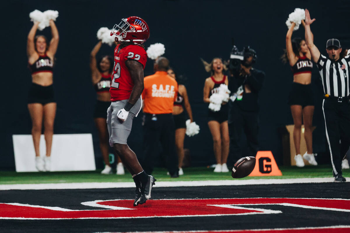 UNLV running back Jai'Den Thomas (22) celebrates a touchdown in the end zone during a game agai ...
