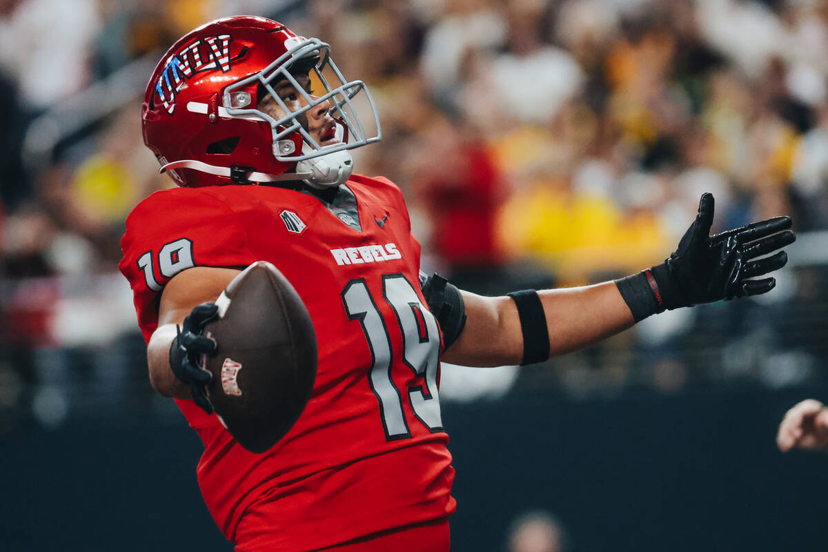 UNLV tight end Kaleo Ballungay (19) celebrates a touchdown in the end zone during a game agains ...