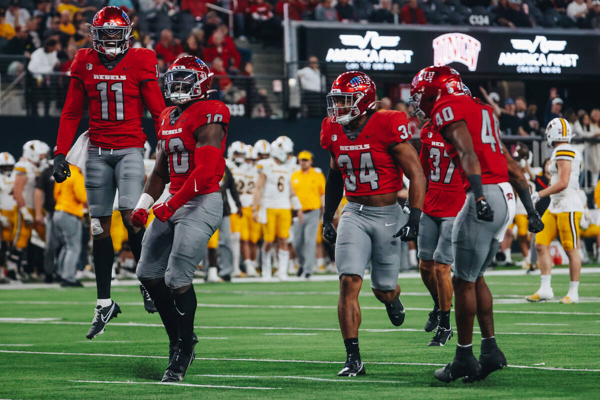 UNLV players celebrate a sack during a game against Wyoming at Allegiant Stadium on Friday, Nov ...