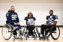 Raiders wheelchair football team members, Nicholas "OLA" Marasco, left, Beya Tep, and ...