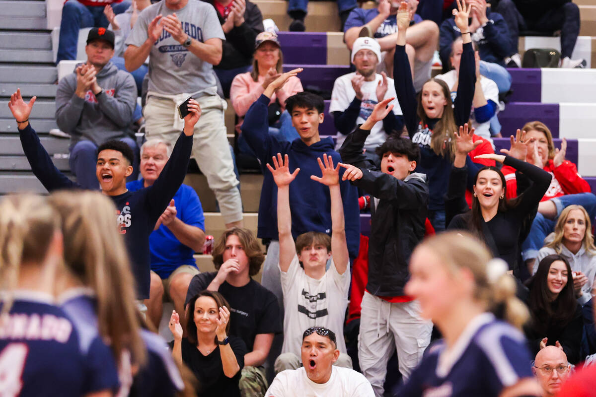 Coronado fans go wild after Coronado wins a point during the class 5A girls volleyball state ti ...