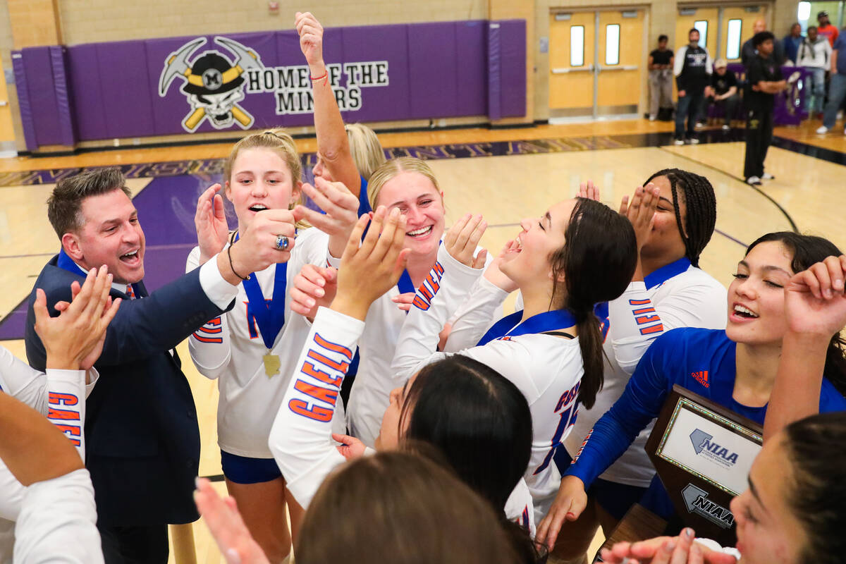 Bishop Gorman celebrates winning the class 5A girls volleyball state title match against Corona ...