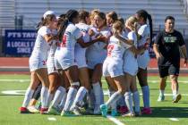 Coronado players and coaches celebrate their 2-1 win against Faith Lutheran during their Class ...