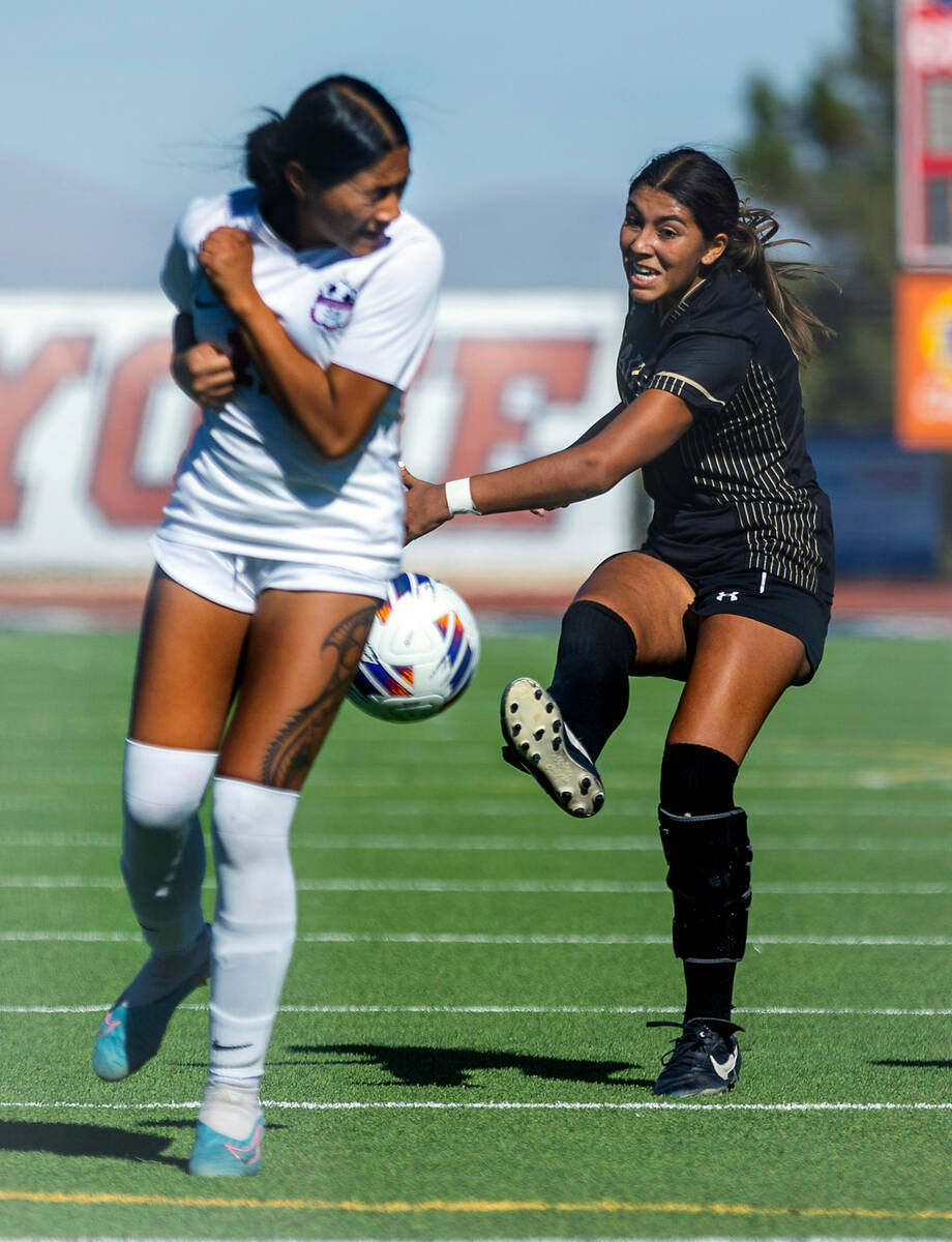 Faith Lutheran midfielder Andrea Levya (10) kicks the ball against Coronado defender Tielua Ba ...