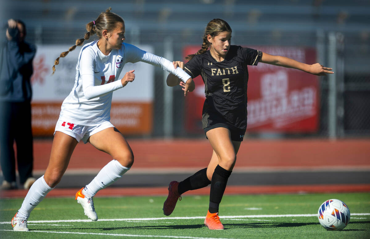 Faith Lutheran midfielder Olivia Stark (8) races Coronado defender Allison Kleiner (14) to the ...