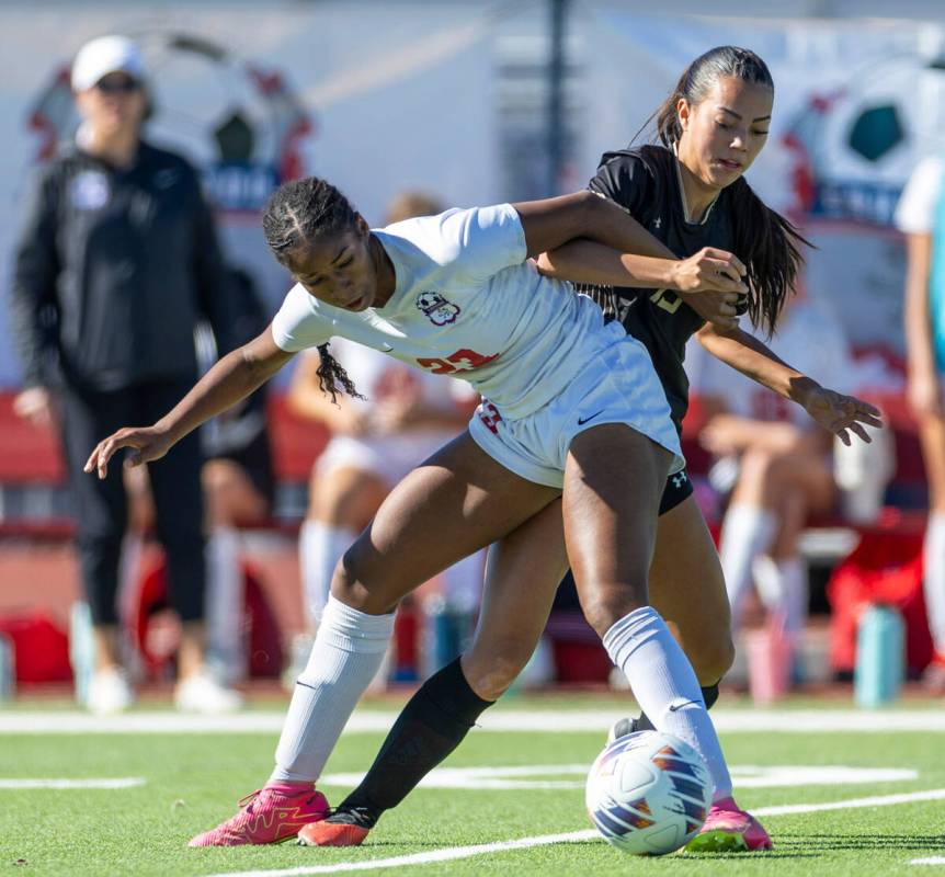 Coronado forward Sierah McCallum (23) controls the ball in front of Faith Lutheran defender Gwe ...