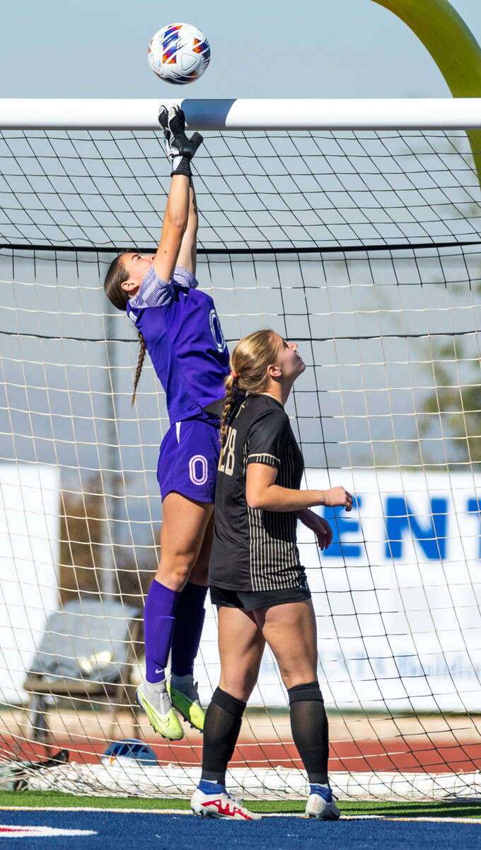 Coronado goalkeeper Megan Kingman (0) elevates to deflect a shot above Faith Lutheran forward A ...