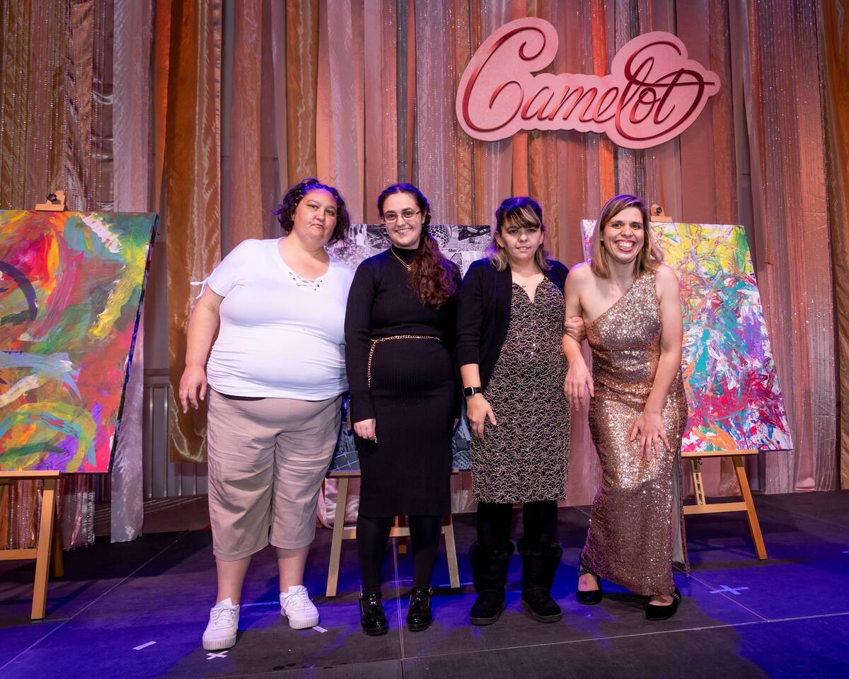 A group of Opportunity Village residents and artists are shown during the annual Camelot gala a ...
