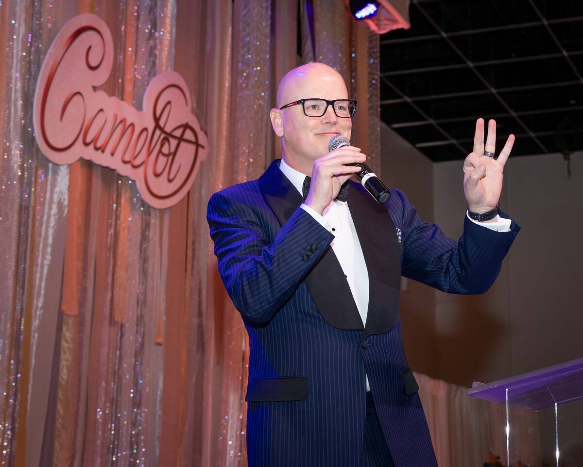 Emcee Chet Buchanan shown the annual Camelot gala at the newly renamed Linda & Christopher Smit ...