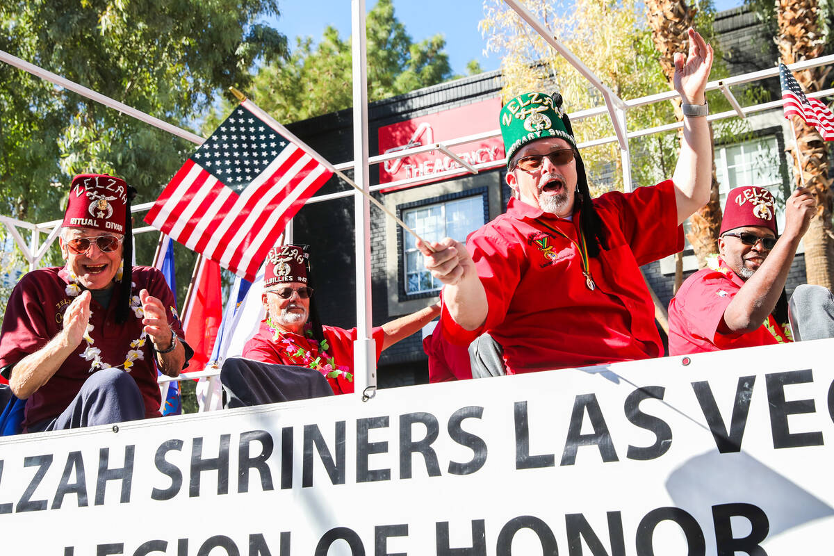 Zelzah Shriners Las Vegas Legion of Honor waves to the crowd during the annual Veterans Day par ...