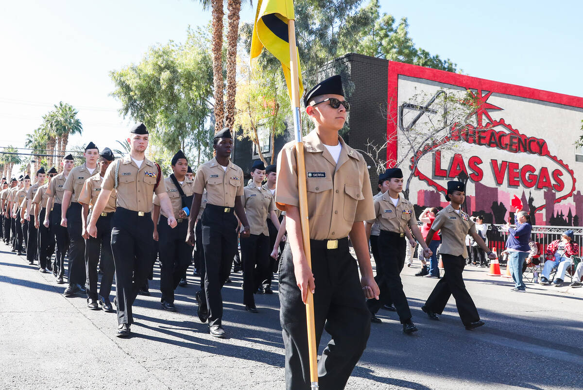 Centennial High School ROTC marches during the annual Veterans Day parade on 4th Street in down ...