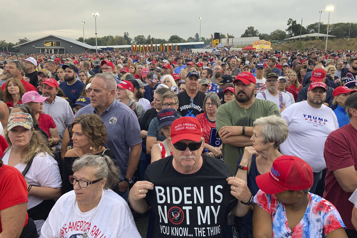 People gather ahead of an appearance by Donald Trump at a rally at the Iowa State Fairgrounds i ...