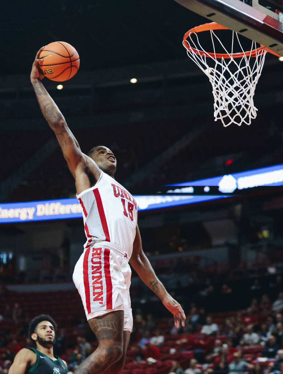 UNLV guard Luis Rodriguez (15) goes for a layup during a game against Stetson at Thomas & M ...