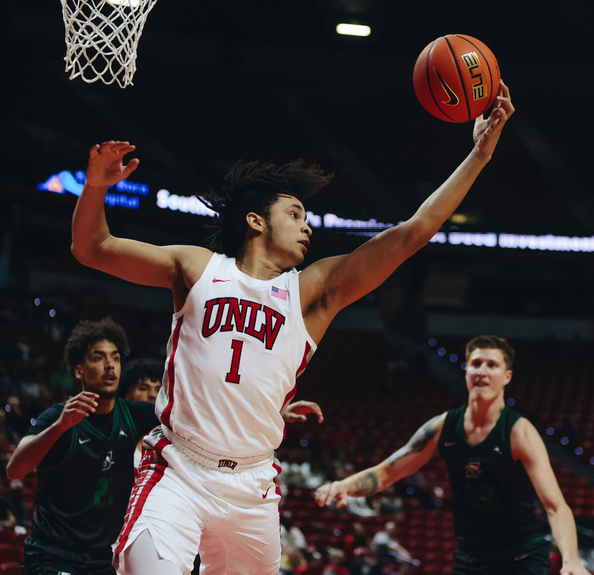 UNLV forward Jalen Hill (1) grabs the ball for a rebound during a game against Stetson at Thoma ...