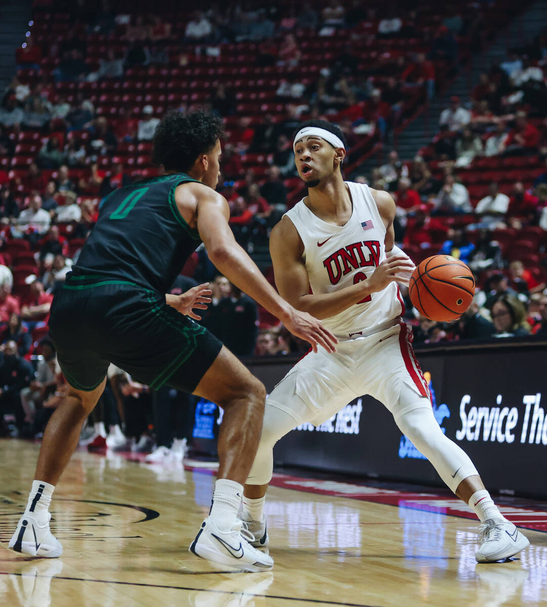 UNLV guard Justin Webster (2) looks to pass the ball to a teammate during a game against Stetso ...