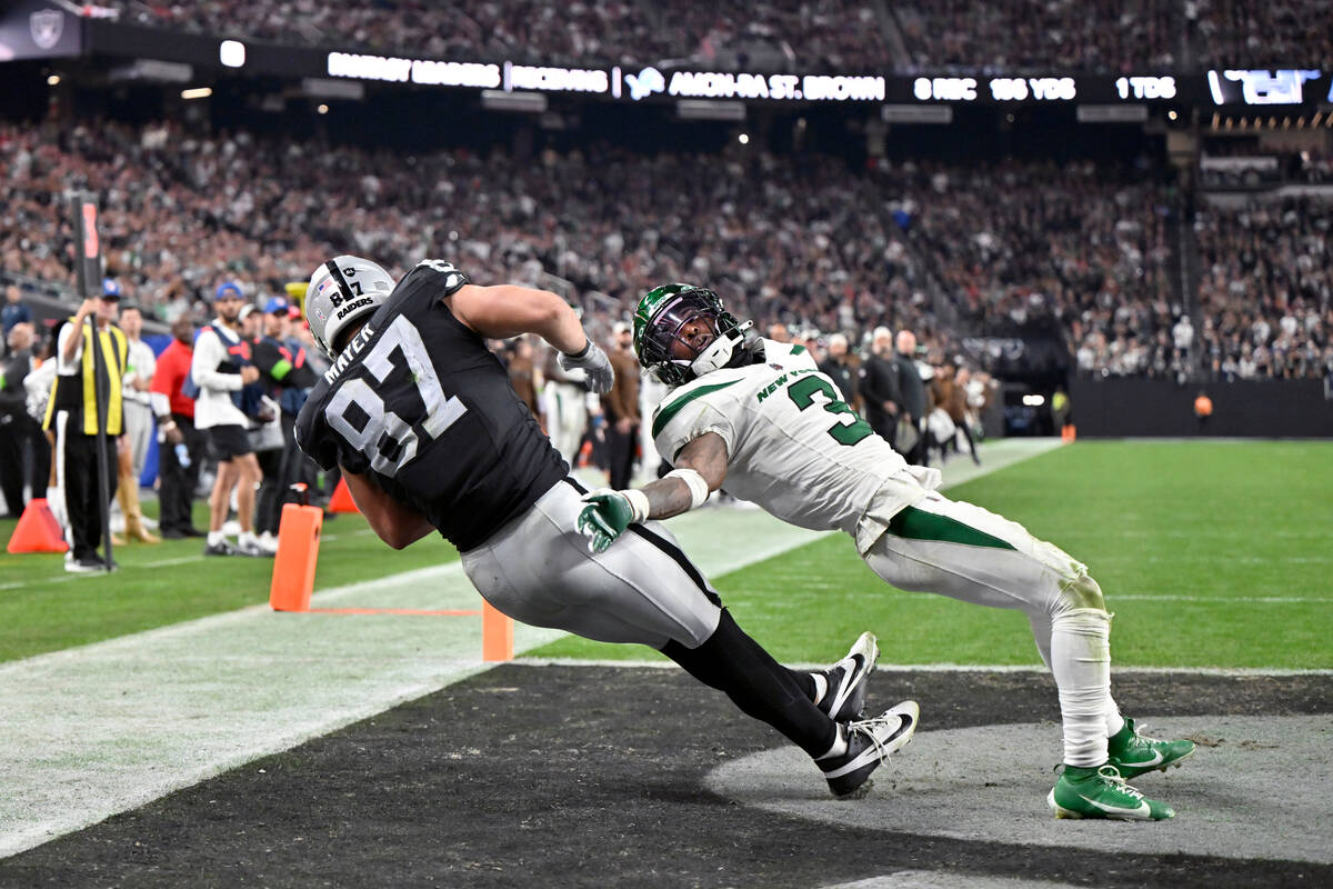 Las Vegas Raiders tight end Michael Mayer (87) catches a touchdown pass as New York Jets safety ...