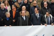 From left, Front, French Prime Minister Elisabeth Borne, Former French President Francois Holla ...