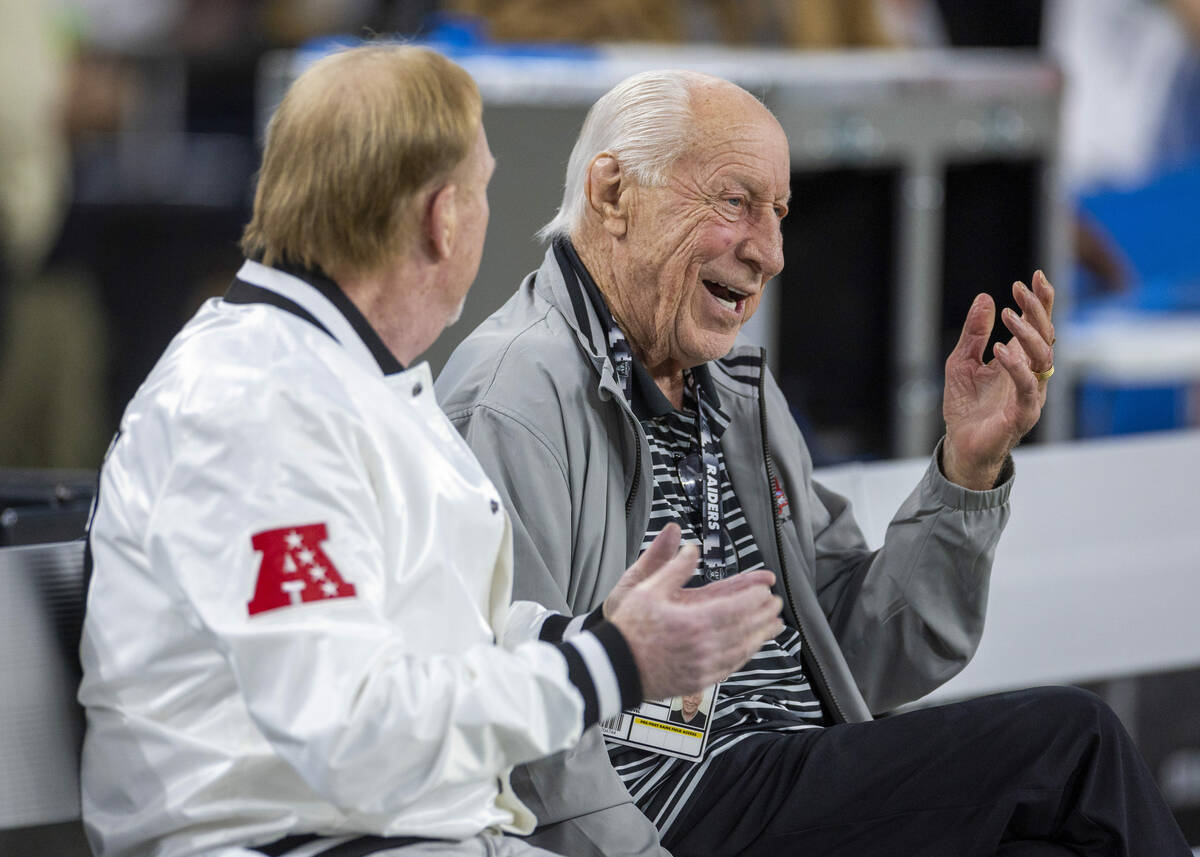Raiders owner Mark Davis chats with Raiders legend and Hall of Famer Fred Biletnikoff on the be ...