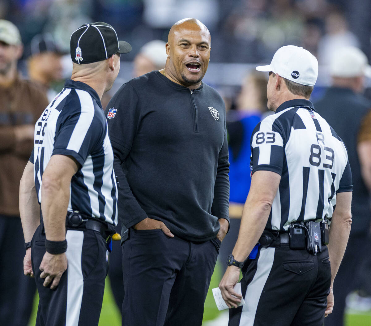 Raiders head coach Antonio Pierce talks with officials before the first half of their NFL game ...