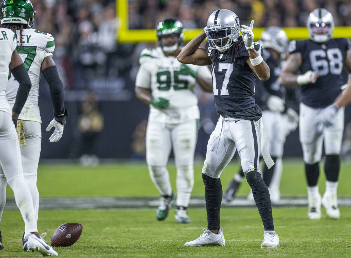 Raiders wide receiver Davante Adams (17) signals another first down after a reception against t ...