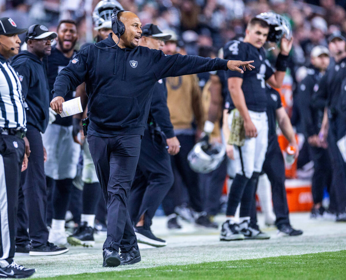 Raiders head coach Antonio Pierce yells to his players against the New York Jets during the sec ...