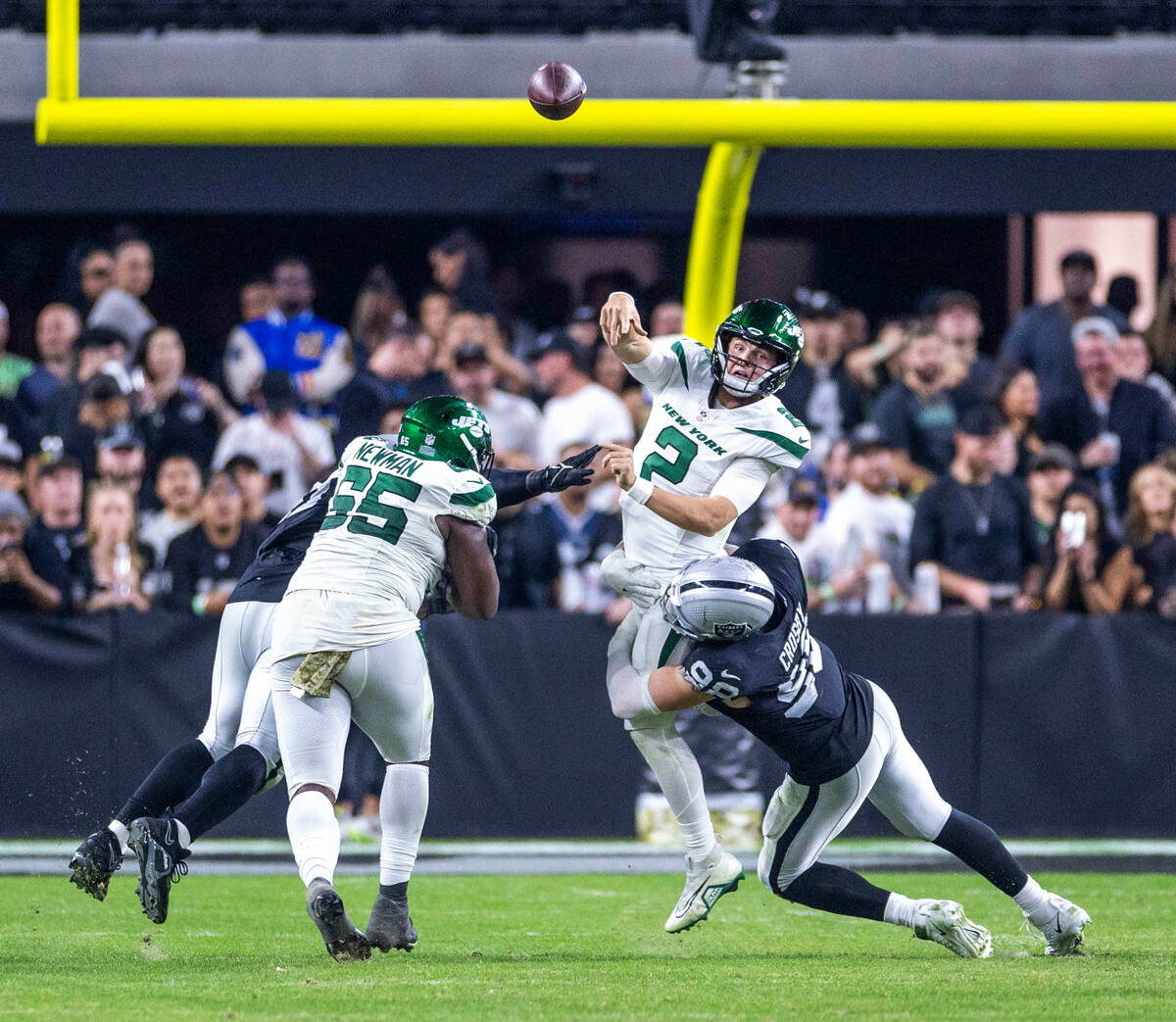 Raiders defensive end Maxx Crosby (98) rushes another pass by New York Jets quarterback Zach Wi ...