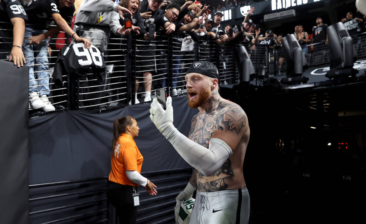 Raiders defensive end Maxx Crosby (98) dies a live broadcast as he leaves the field against the ...