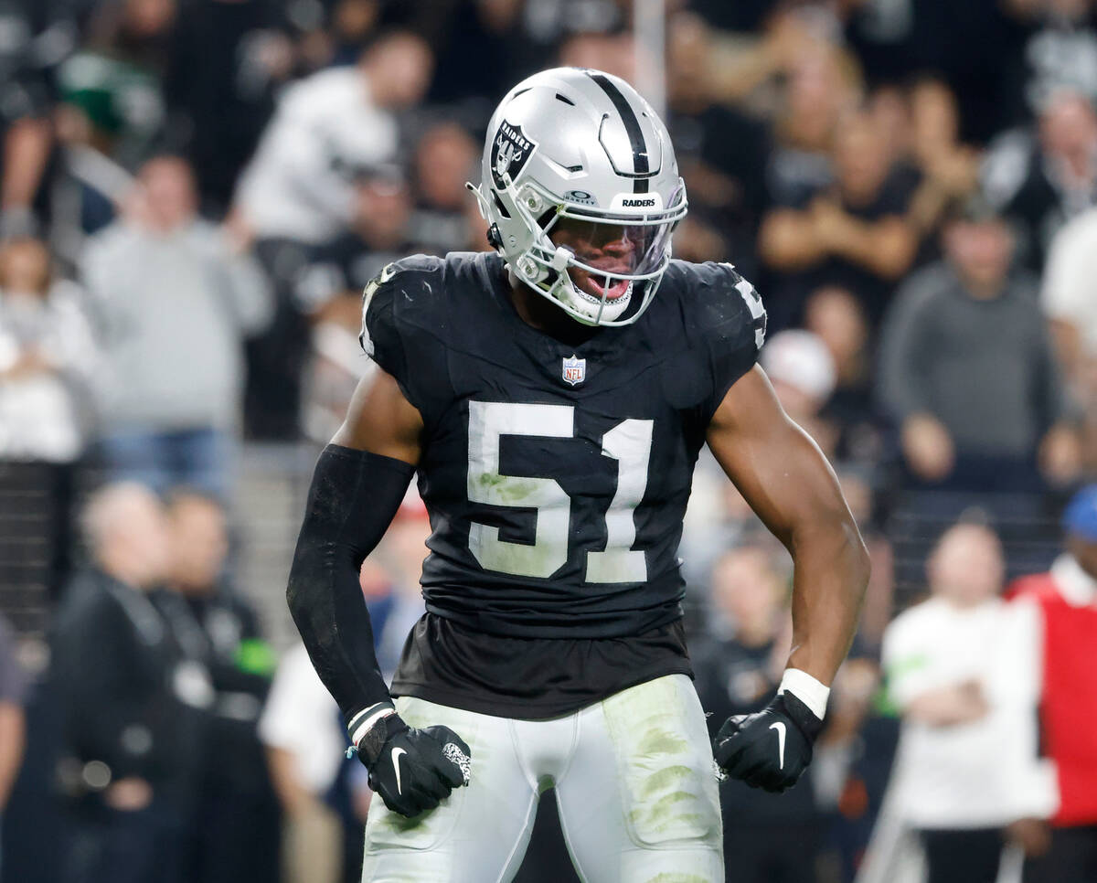 Raiders defensive end Malcolm Koonce (51) reacts after sacking New York Jets quarterback Zach W ...