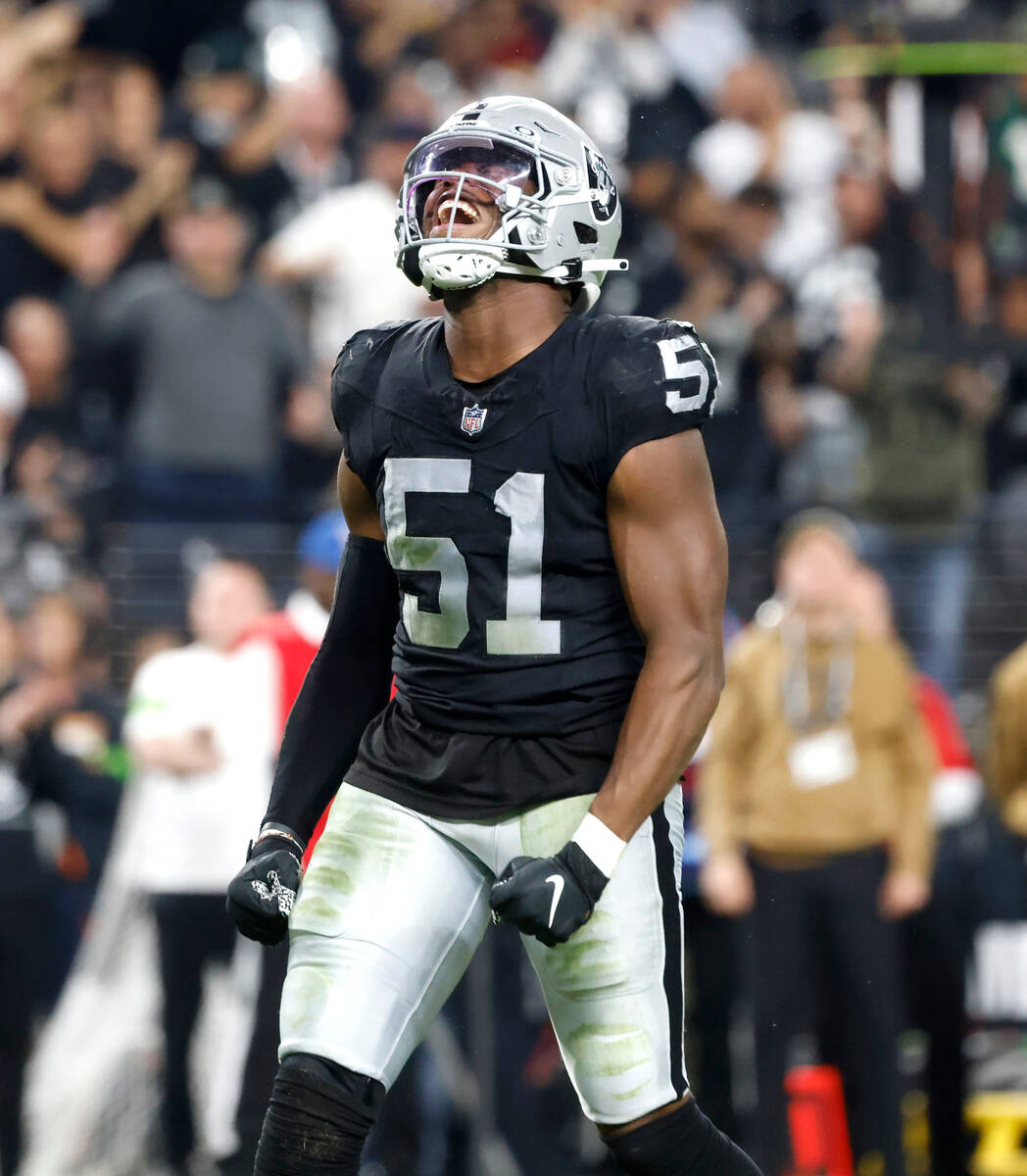 Raiders defensive end Malcolm Koonce (51) reacts after sacking New York Jets quarterback Zach W ...
