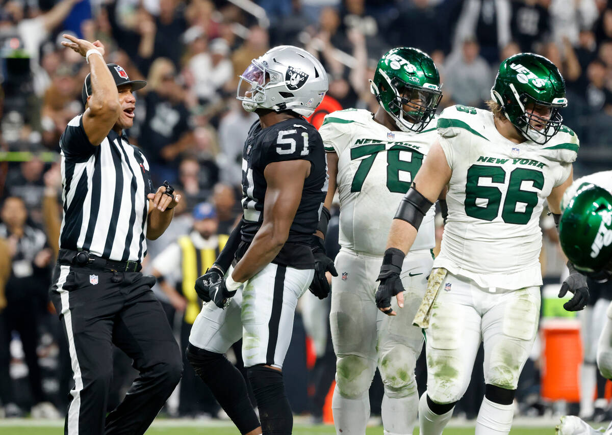 Raiders defensive end Malcolm Koonce (51) reacts in front of New York Jets defense after sackin ...