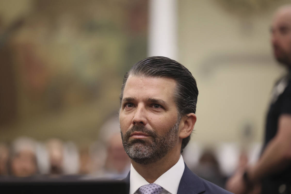 Donald Trump, Jr. sits in the courtroom with his legal team before the continuation of the civi ...