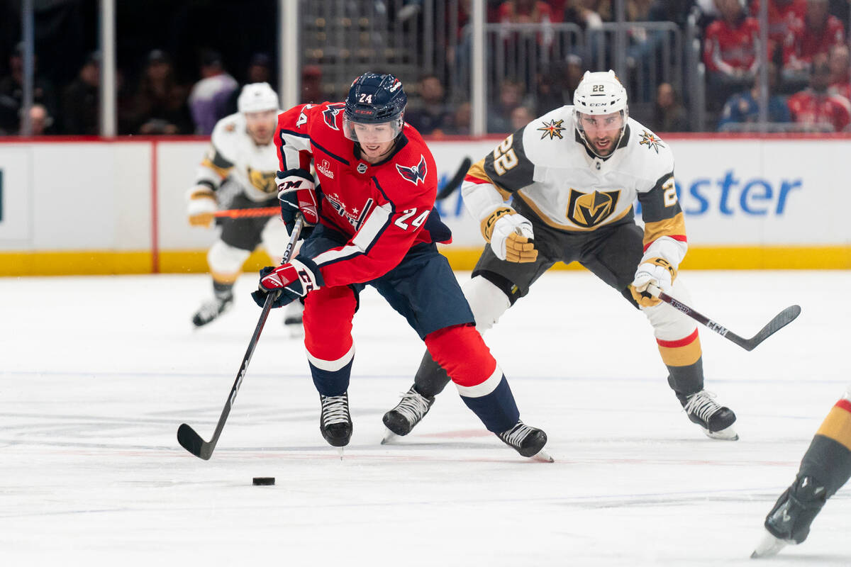 Washington Capitals center Connor McMichael and Vegas Golden Knights right wing Michael Amadio ...