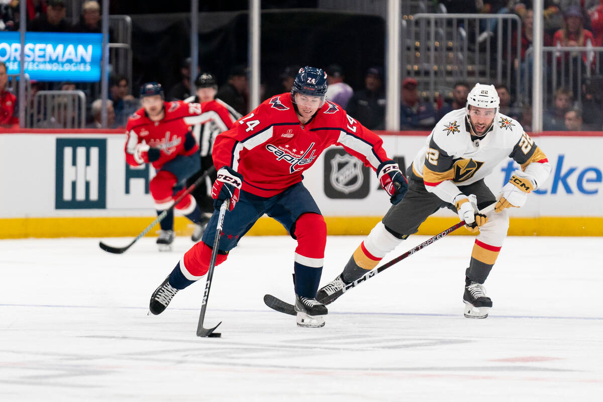 Washington Capitals center Connor McMichael (24) and Vegas Golden Knights right wing Michael Am ...