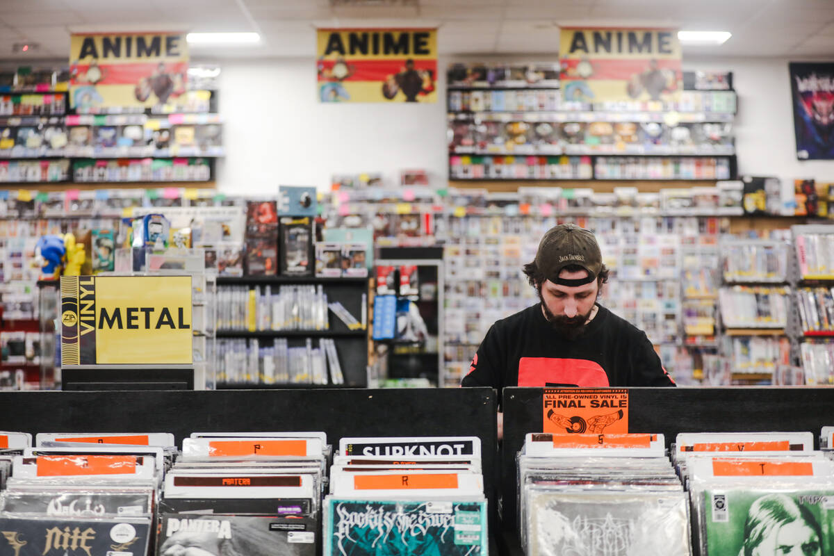 Oliver Little shops for vinyl records at Zia Records in Las Vegas, Monday, Nov. 13, 2023. (Rach ...