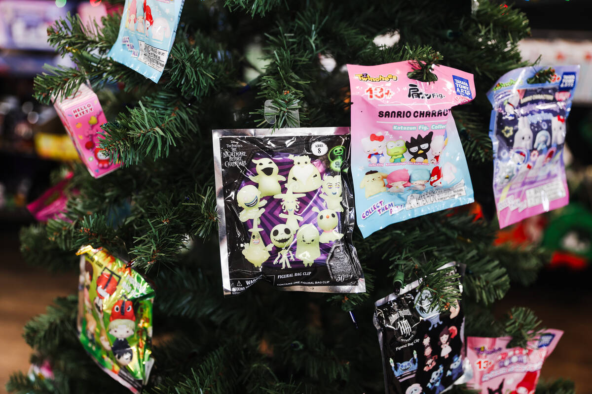 Merchandise hangs in a tree for sale at Zia Records in Las Vegas, Monday, Nov. 13, 2023. (Rache ...